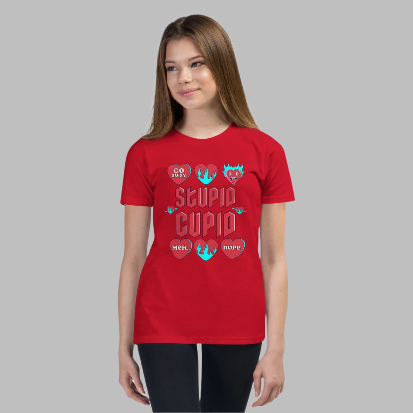 Image: Stupid Cupid Anti Valentines Day T-shirt for Kids. This sweatshirt is for girls and boys with red 90s style text that reads Stupid Cupid, with conversation hearts that are on fire, or say Go Away, Meh, Nope. Great for school party, by jaecrece