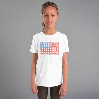 White unisex patriotic shirt for boys and girls. The graphic is an American flag, made up of Blue and Red Vintage smiley faces, by jaecrece.com