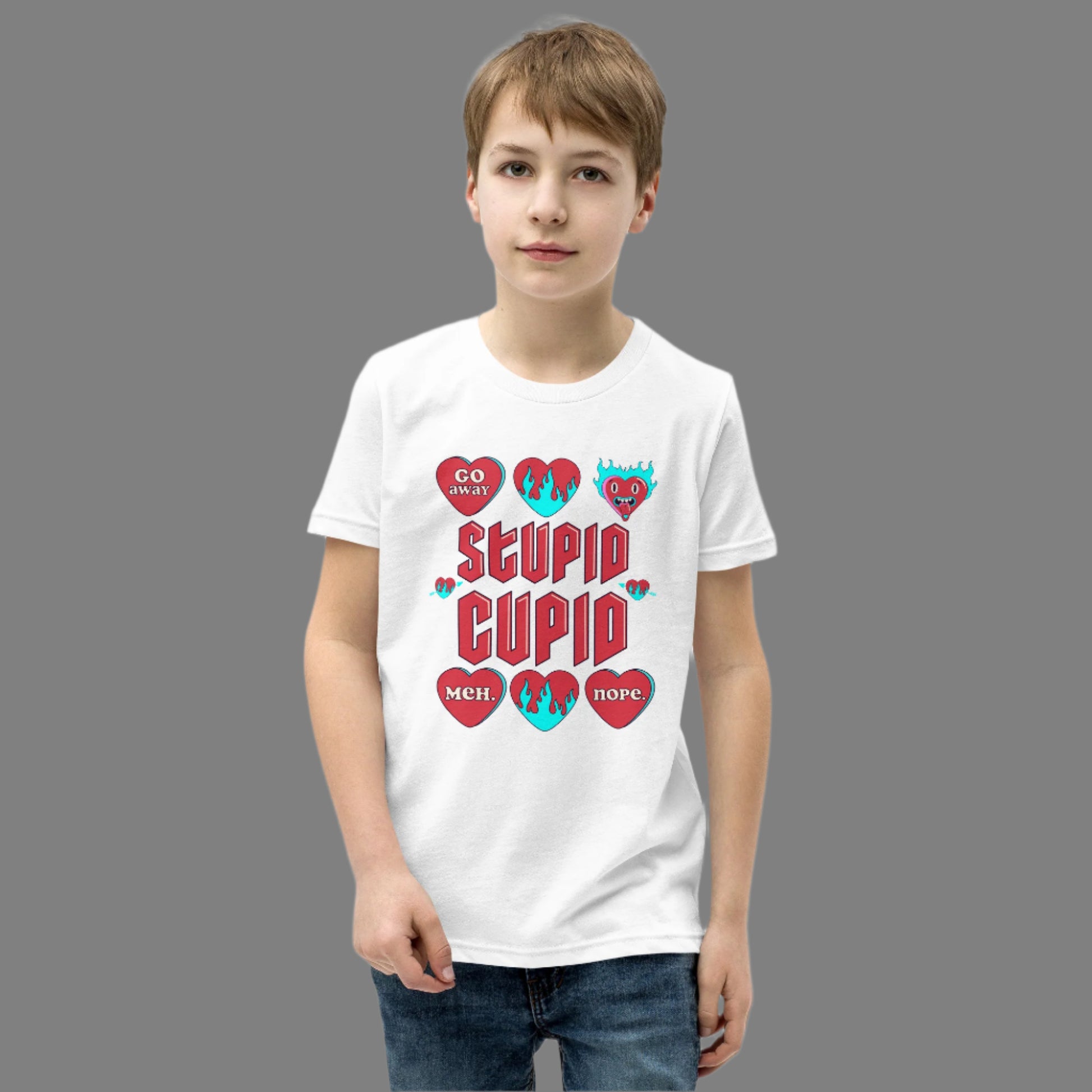 Image: Stupid Cupid Anti Valentines Day T-shirt for Kids. This sweatshirt is for girls and boys with red 90s style text that reads Stupid Cupid, with conversation hearts that are on fire, or say Go Away, Meh, Nope. Great for school party, by jaecrece