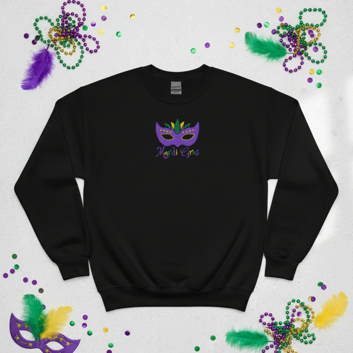This youth Mardi Gras embroidered sweatshirt brings the fun of New Orleans to your child’s wardrobe. With a colorful mask and festive “Mardi Gras” stitched in purple, green, and gold, it’s made for parade watching, classroom celebrations, or family parties. Available in sizes XS–XL, and part of a matching family Mardi Gras outfit set. A must-have for parents looking for Mardi Gras fashion for kids.